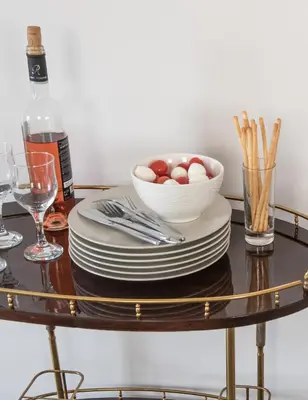 a table with plates and a bowl of eggs at Valeria's Sea View Apartment in Athens