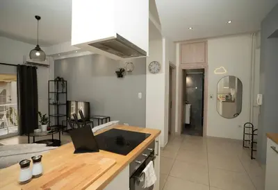 a kitchen with a sink and a counter top at E44 by SpitiSou in Athens