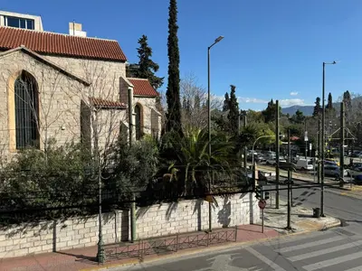 a building on the side of a street at Athenian Gate Residence to Plaka in Athens