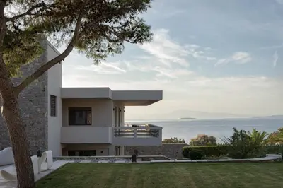 a house with a view of the ocean at Villa Vel Aegina in Vaia