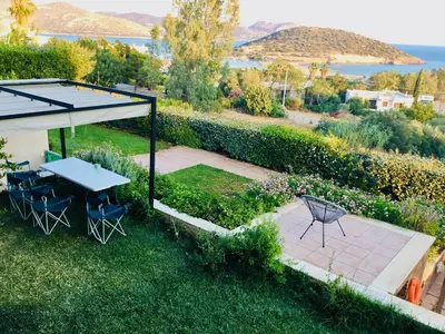an overhead view of a garden with a table and chairs at Villa Infinity View Athens Riviera in Anavissos