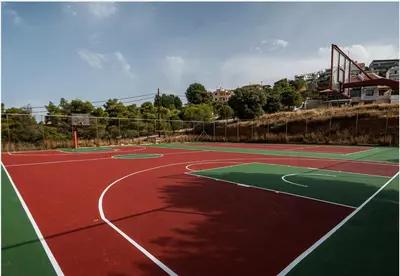 a basketball court with a net on top of it at Villa Infinity View Athens Riviera in Anavissos