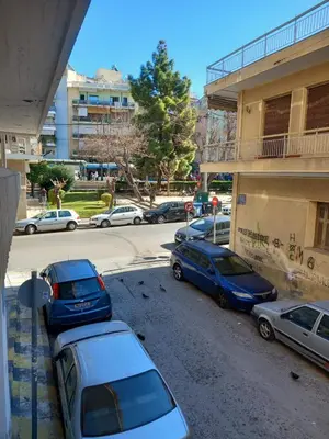 a group of cars parked in a parking lot at Leo Athens Apartment Near Tram Station in Athens