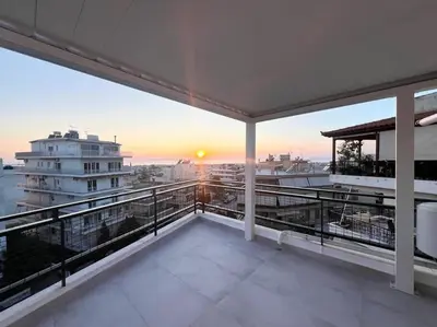 a balcony with a view of a building at Luxury Penthouse w/ sea view in Athens