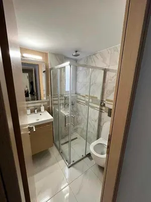 a bathroom with a shower and a toilet at Elegant & Modern Apartment near to Athens Riviera in Piraeus