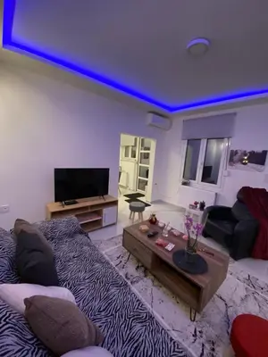 a large living room with a blue ceiling at Alexandra apartment in Athens