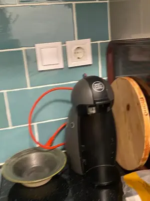 a coffee maker sitting on top of a counter at Antinoros Inn, Stylish apartment,3' to Metro in Athens