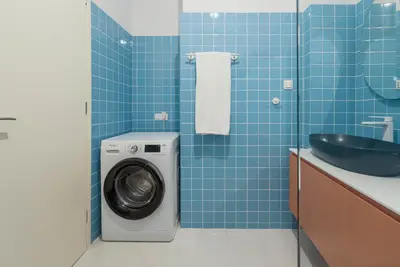 a bathroom with a washing machine and a sink at A Place 4U 42, 1 Bedroom & 1 Bathroom, near to Acropolis Athens in Athens