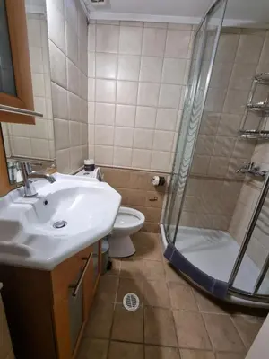 a bathroom with a sink and a shower and a toilet at athens.apartotel.3 in Athens