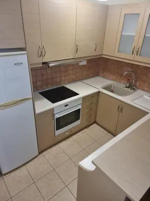 a kitchen with a white refrigerator and a sink at athens.apartotel.3 in Athens