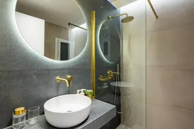 a bathroom with a sink and a mirror at Mystique 2-Bedroom Apartment in Athens in Athens