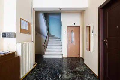 a hallway with a staircase in a building at Mystique 2-Bedroom Apartment in Athens in Athens