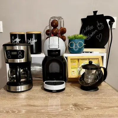 a coffee maker sitting on a counter with a coffee pot at Your Cozy Home in Athens in Athens