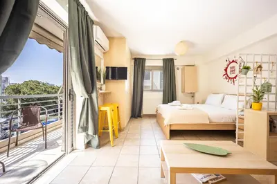 a hotel room with a bed and a balcony at Front-Row Acropolis View Balcony - Central Athens in Athens