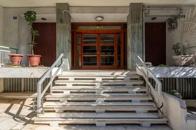 a set of stairs in front of a building with a door at Exclusive and Deluxe Apartment in Athens City in Athens