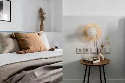 a bedroom with a bed and a table with a lamp at Contemporary Bliss 2BR Apartment in Athens by UPSTREET in Athens