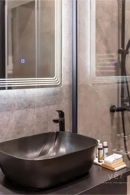 a black bowl sink on a counter in a bathroom at Nature-Infused Vibes & Nightlife in Athens
