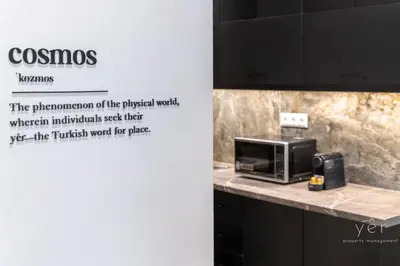 a sign for a kitchen with a microwave on a counter at Nature-Infused Vibes & Nightlife in Athens