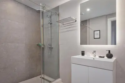 a bathroom with a shower and a sink at Syntagma Unique Penthouse in Athens