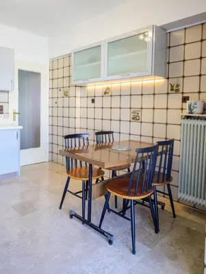a table and four chairs in a kitchen at Batis Sea View in Athens