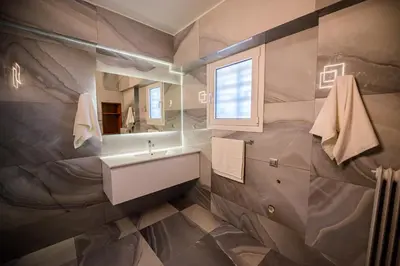 a bathroom with a sink and a mirror at Batis Sea View in Athens