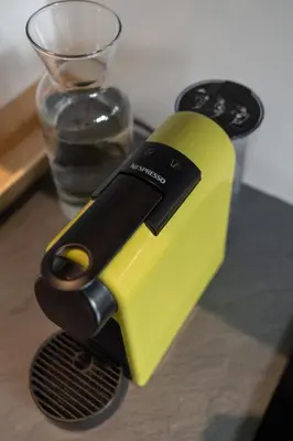 a yellow and black appliance sitting on a table at Pagkrati Urban Living in Athens