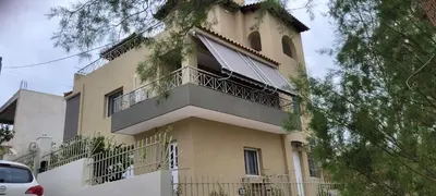 a large yellow building with a balcony on it at Starfish Complex in Porto Rafti