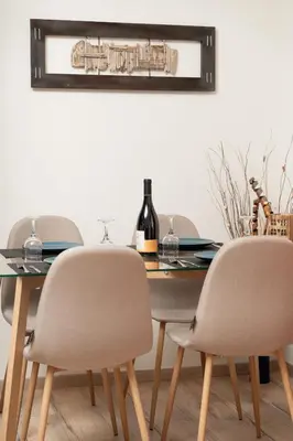 a dining room table with two chairs and a bottle of wine at Starfish Complex in Porto Rafti