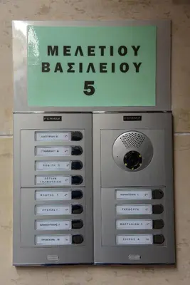 a metal machine with a sign on top of it at Lovely Apartment in Athens