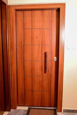 a wooden door in a room with at Lovely Apartment in Athens