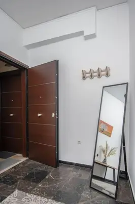 a room with a mirror and a closet at Lovely,central, spacious 2-bedrooms apartment in Piraeus