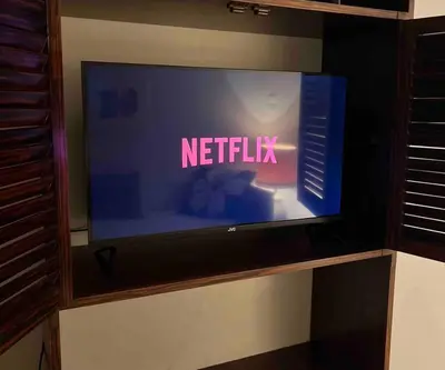 a television screen with the words netflix on it at 4th floor cosy apartment in Metaxourgeio in Athens