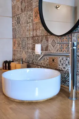 a white sink in a bathroom with a mirror at City Break Apartment 4' to Metro in Athens