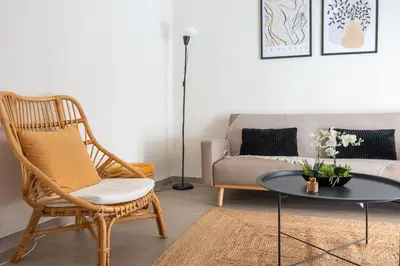 a living room with a couch and a chair and a table at City Break Apartment 4' to Metro in Athens