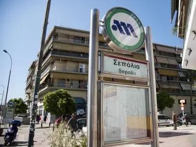 a sign in front of a building with a sign for a street at City Break Apartment 4' to Metro in Athens