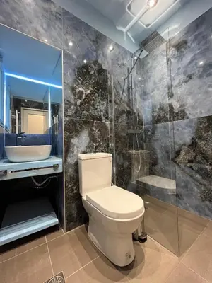 a bathroom with a toilet and a sink at Artist's 1 BD Apt in Keramikos in Athens