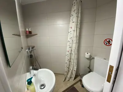 a bathroom with a toilet and a sink at Azure Studio in Athens