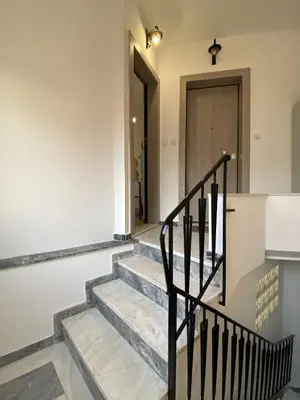 a staircase leading to the front door of a house at Azure Studio in Athens
