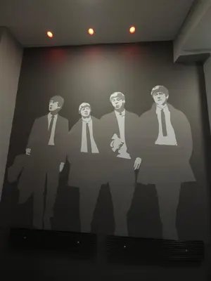 a wall with a painting of four men and a woman at DIONE Luxury Business Suite in the heart of Athens in Athens