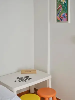a room with a white table and two stools at Parthenon Panorama 3bd in Athens