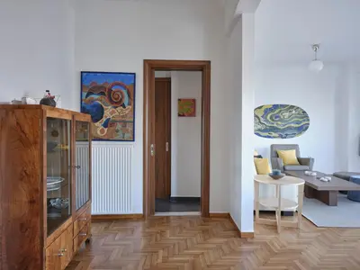 a living room with a couch and a table at Parthenon Panorama 3bd in Athens