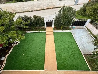 an aerial view of a garden with a lawn at DianaBNB in Artemida