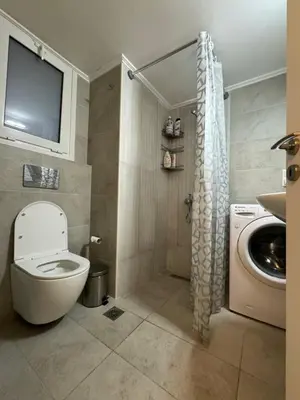a bathroom with a toilet and a sink at ARIS Patisia in Athens