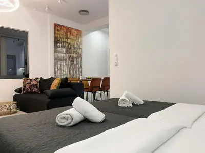 a bedroom with a bed with towels on it at Lucky Elegant Home #12 VIPGreece in Athens
