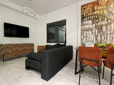 a living room with a couch and a table at Lucky Elegant Home #12 VIPGreece in Athens