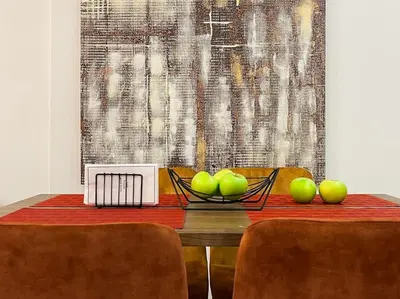 a dining room table with a bowl of apples on it at Lucky Elegant Home #12 VIPGreece in Athens