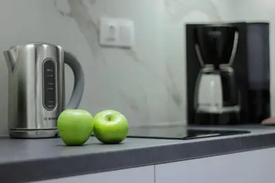 two green apples sitting on a counter in a kitchen at Lucky Elegant Home #12 VIPGreece in Athens