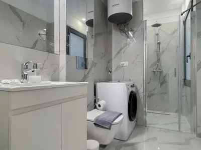 a bathroom with a toilet and a sink and a shower at Lucky Elegant Home #12 VIPGreece in Athens