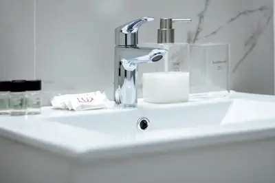 a bathroom sink with a faucet on a counter at Lucky Elegant Home #12 VIPGreece in Athens