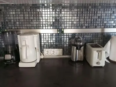 a counter top with a coffee maker and a blender at Κατερινα in Athens